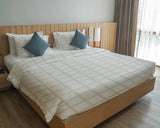 Set di biancheria da letto con coperta terapeutica arancione beige a quadri