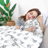 Set di biancheria da letto con coperte terapeutiche bianche e orecchini boho