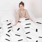 Set di biancheria da letto con coperte terapeutiche e strisce nere