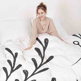 Set di biancheria da letto con coperte terapeutiche bianco con rami neri