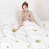 Set di biancheria da letto con coperte terapeutiche quadrati dorati