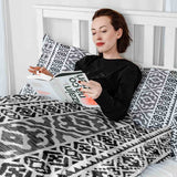Set di biancheria da letto con coperte terapeutiche e forme nere