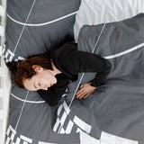 Set di biancheria da letto con coperta terapeutica grigio scuro con strisce bianche